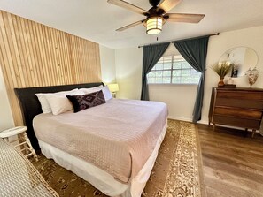 Spacious master bedroom with comfy bedding & new memory foam mattress. 