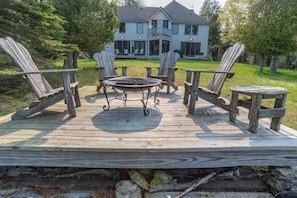 A great gathering spot at the lake's edge. Hand made Adirondack chairs. Enjoy the firebowl at night or side table for your morning coffee!