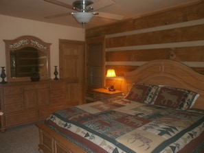 One of two master suites on the main floor has beautiful Broyhill furniture