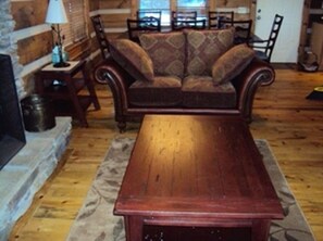 Spacious living and dining area in front of the fireplace with seating for 10