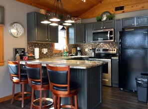 Fully remodeled kitchen is nicely equipped for easy dining at home