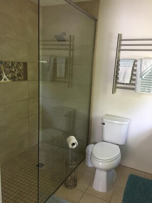 Master bath with doorless shower.  Bath towels provided.