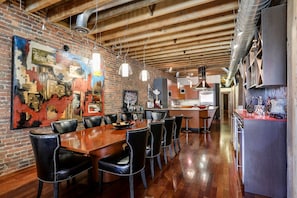 Dining table seats 10, and bar lead into gourmet kitchen
