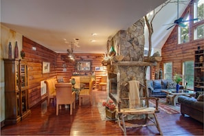 Stacked Stone Fireplace central to Great Room and Dining Room