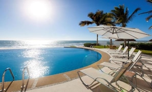 Infinity pool with lounge chairs