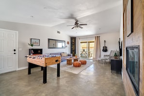 Living room with a foosball table.