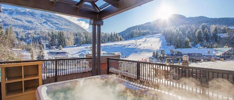 Soak in your private hot tub near the slopes!