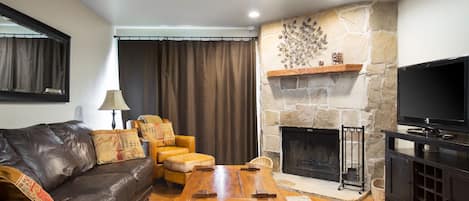 Living room with wood-burning fireplace. Firewood is provided.