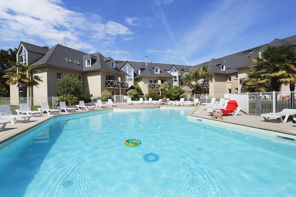 Dive into the pristine outdoor pool in the summer.