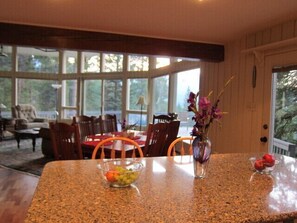 Island and dining room table with room for eight