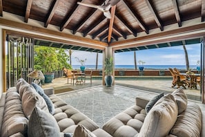 Living Room with Sofa and Folding Windows to the Pool and Lanai