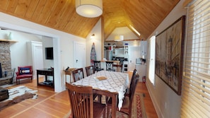 Dining room with high vaulted wood ceilings