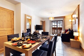 Prepare meals in the kitchen and enjoy them at the dining table.