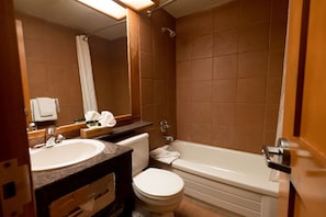 The 4-piece bathroom includes granite counters and a shower-tub combination.