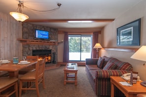 Relax in the cozy living area and enjoy the beautiful fireplace.