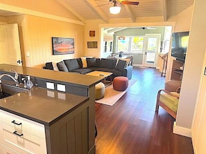 Living room with large comfy couch for watching television.