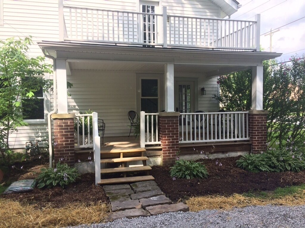 The side porch is a cool spot to hang out on a hot afternoon.