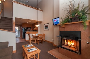 Cozy up in front of the majestic wood-burning fireplace, firewood included!