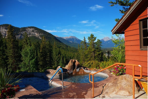 Soak in these incredible SHARED hot tubs overlooking the town of Banff and the Rockies