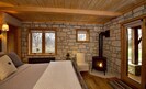 Willow room equipped with gas fireplace and french doors opening onto patio