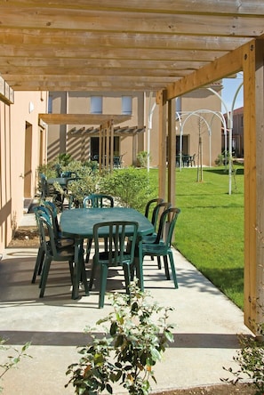 Soak up the sun in your lovely private furnished garden area.