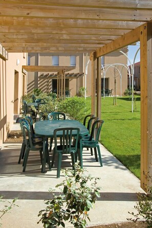 Soak up the sun in your lovely private furnished garden area.