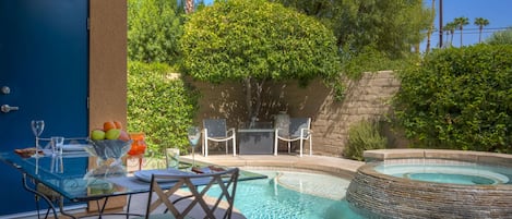 The private pool and hot tub with al fresco dining