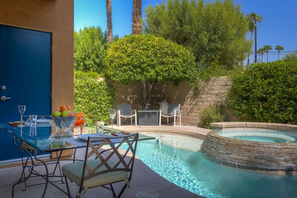 The private pool and hot tub with al fresco dining