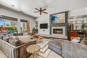 Great Room: Living Area with section sofa, chaise lounger, gas fire place and wet bar.