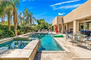 Backyard:  Pool & Spa with sheet water fall feature. Pool Deck with Pool Loungers