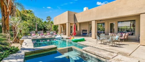 Backyard:  Pool and Spa with Sheet Water Fall feature, Covered Patio Sectional Sofa, Two Dining Tables, Outdoor Fire Place, Pool Loungers and BBQ with Bar.