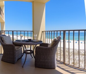 Comfortable bistro set.  All balcony furniture is cushioned, even the chaises.