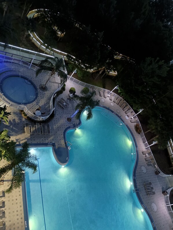 Pool area with lovely large pool that's heated in winter & hot tub