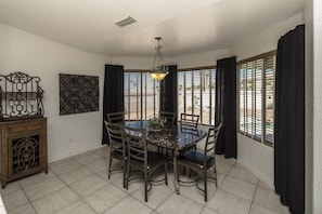 large dining area with pool view