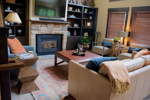 Comfortable living room with cozy fireplace and 55 inch TV