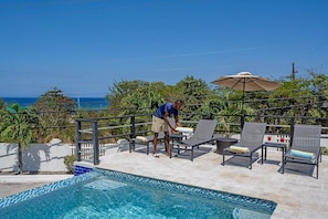 Pool deck with sun loungers