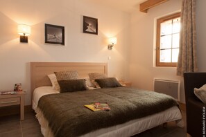 The master bedroom features a lovely wood touches - decorated in the classic chalet style.
