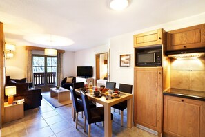 Prepare meals in the equipped kitchenette and enjoy your food at the dining table.