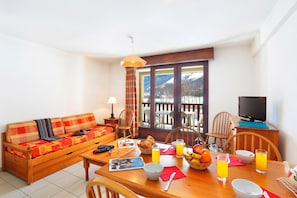The living area is bright and cozy, perfect for relaxing after a wonderful day.