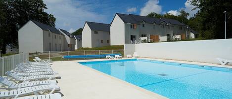 Dive into the outdoor pool during the summer.