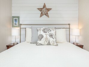 Ship-lap walls in the Bedroom with Queen Bed