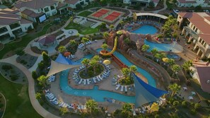 Enjoy the pool, water slide, lazy river, cornhole, and pickleball right off your patio