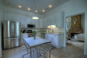 Kitchen: Bright and airy space with stainless steel appliances and homey farm-style charm!