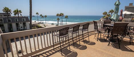 The expansive upper balcony affords breathtaking views of the Pacific Ocean.
