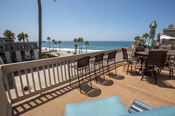 The expansive upper balcony affords breathtaking views of the Pacific Ocean.