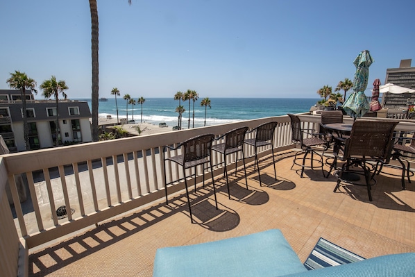 The expansive upper balcony affords breathtaking views of the Pacific Ocean.