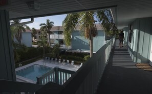 Unit on the top floor of a two-level building, with parking in breezeway below