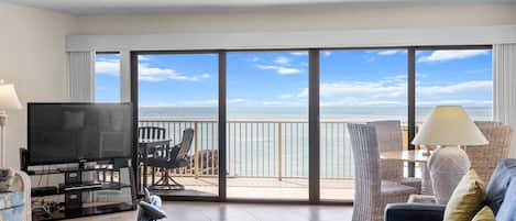 Living Room with plenty of seating, game table and huge open water views