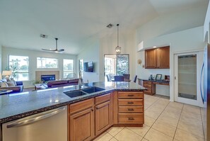Beautiful lake and pool views from the kitchen and living space.