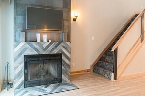 The wood-burning fireplace is perfect for chilly evenings.